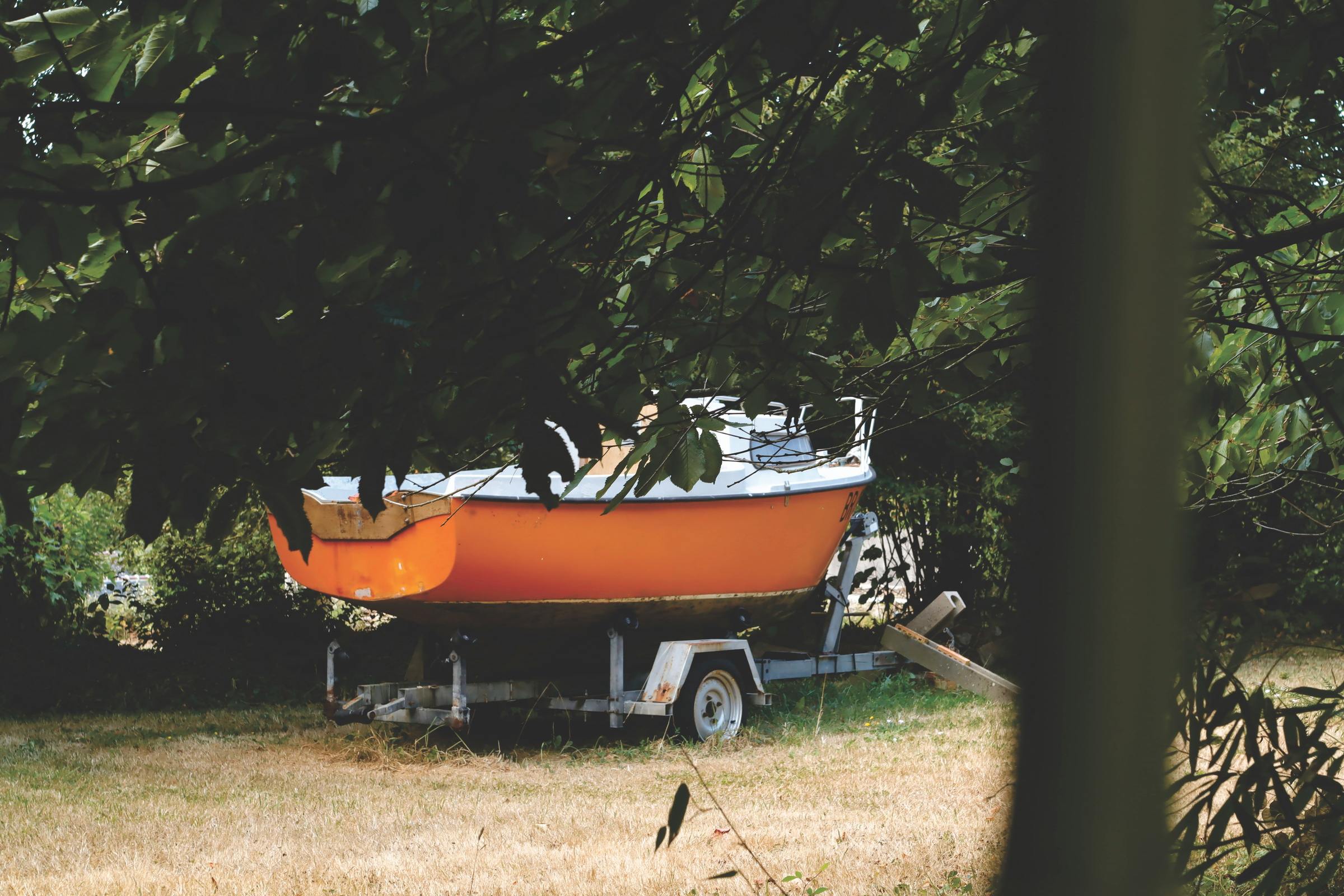 Orange boat on a trailer