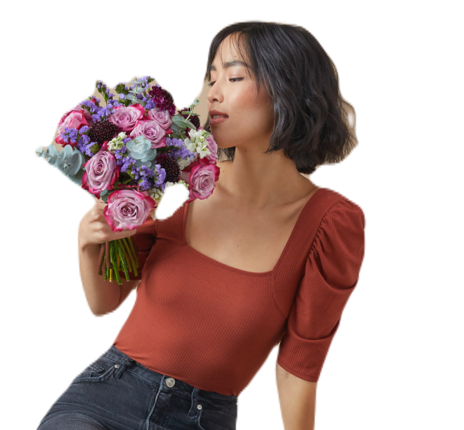 Woman Smelling Flowers