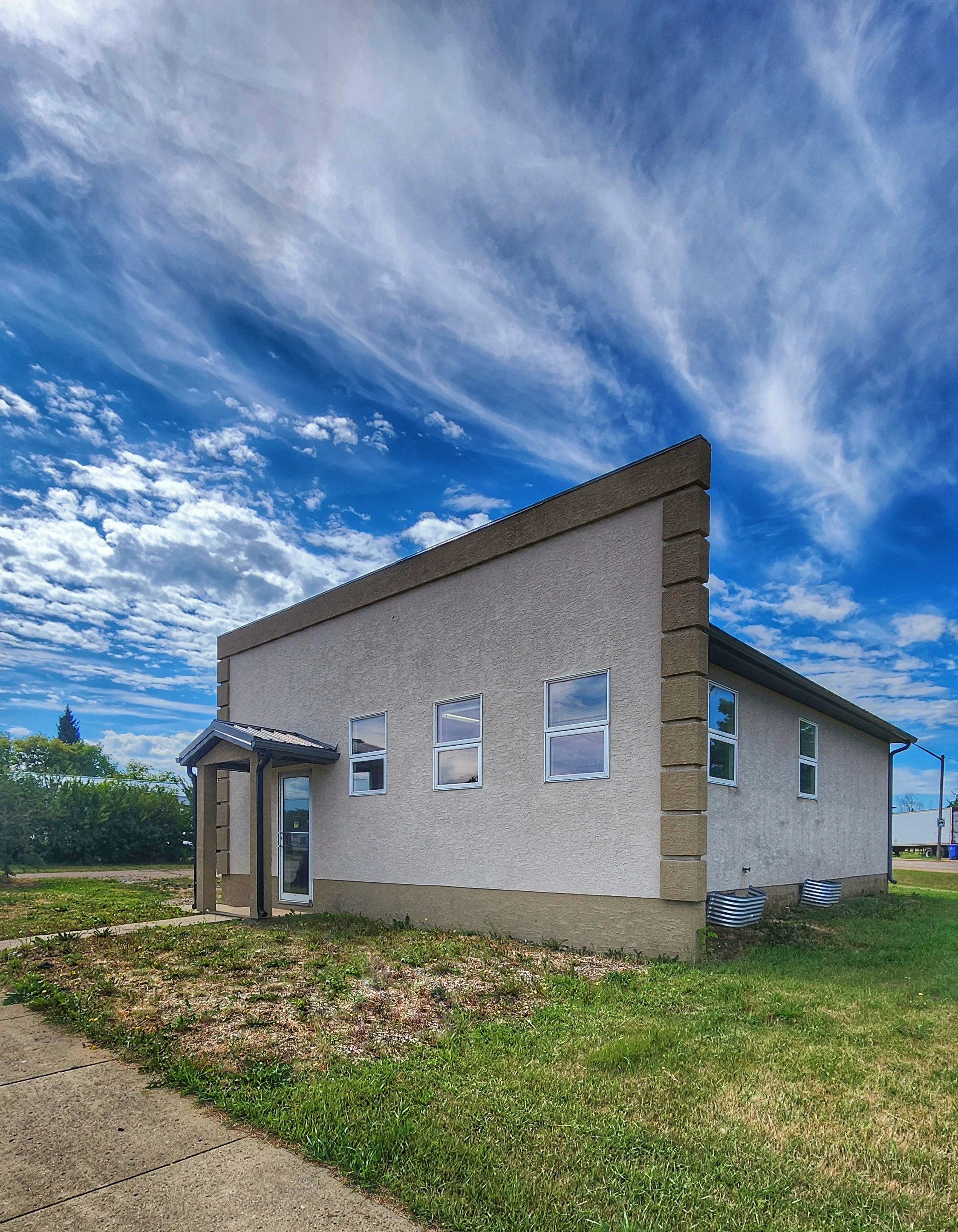 Outside of photography studio with bright blue skies