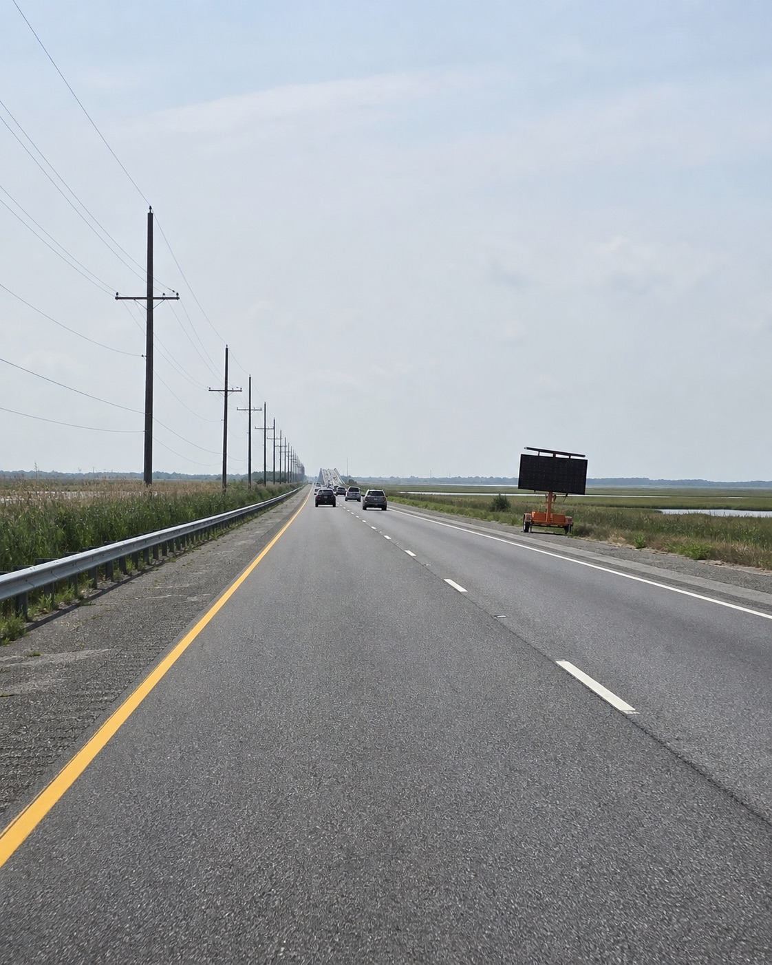 AI-generated illustration inspired by the mainland approach toward LBI, not a present-day traffic photograph.
